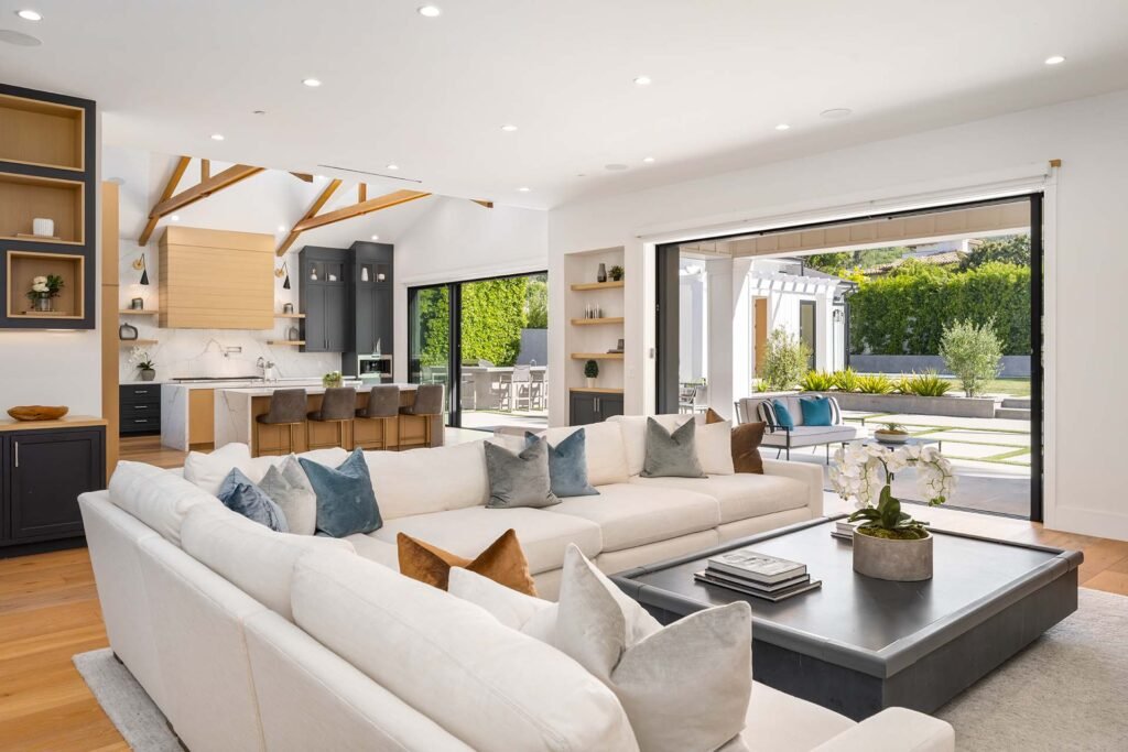 Modern open living room designed through full-service interior design services, combining comfort, function, and timeless beauty.